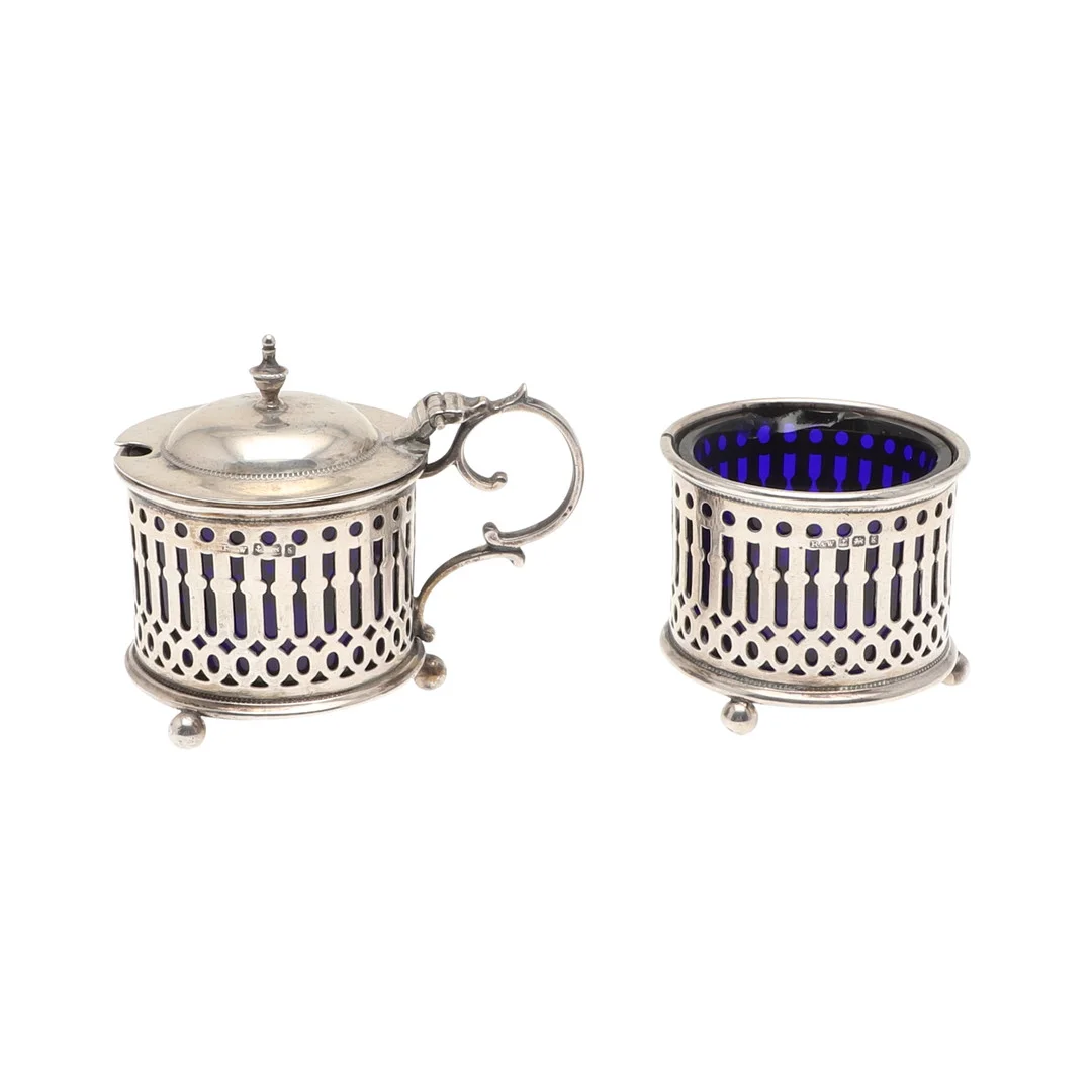 A SILVER CAGED TWO PIECE CRUET. — Silver — Lawrences Auctioneers