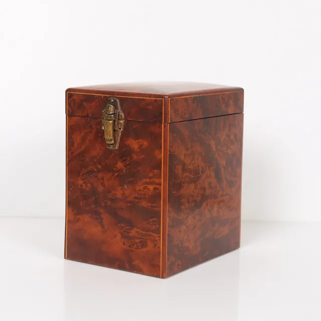 AN UNUSUAL ART DECO AMBOYNA TRAVELLING TEA CADDY.