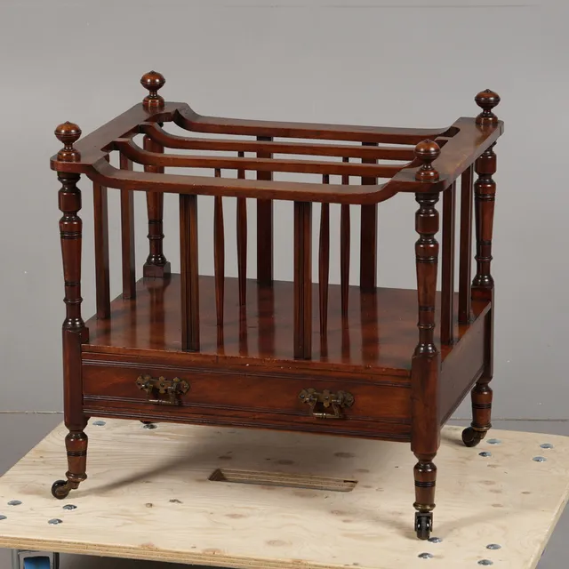 A MID VICTORIAN WALNUT THREE DIVISION CANTERBURY.