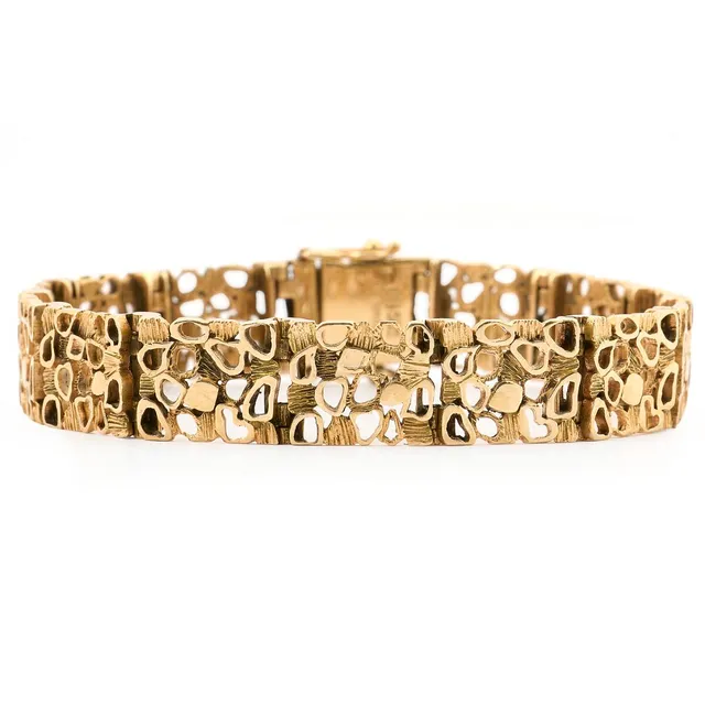Bernhard Hertz: A bracelet of 14k gold. Weight app. 26 g. W. 10 mm. L. 18.2 cm.