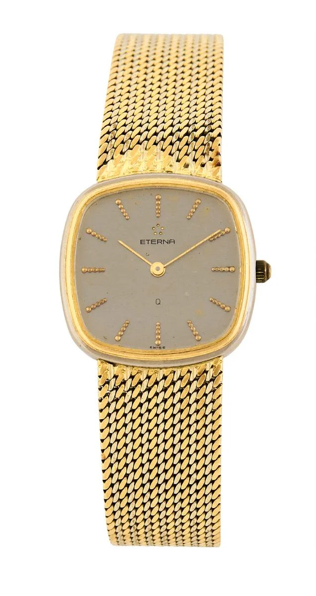 “Bi-Colour” of 18k gold and white gold. Mechanical movement with quartz movement, cal. ETA 959001. Integrated Eterna bracelet of 18k gold with folding clasp. Circumference approximately 17 cm. 23.5×23.5 mm. The watch weighs app. 49 g. 1980s. — Clocks & watches/Wristwatches — Bruun Rasmussen