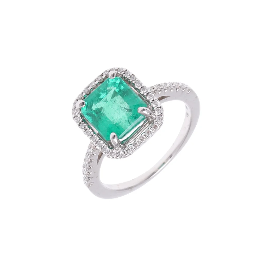 AN EMERALD AND DIAMOND CLUSTER RING. — Rings — Lawrences Auctioneers