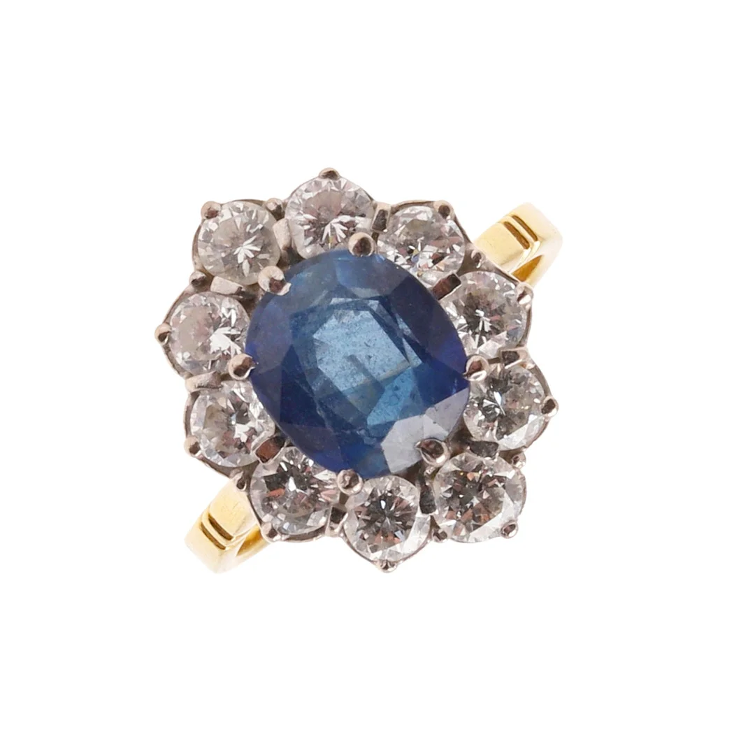 A SAPPHIRE AND DIAMOND CLUSTER RING. — Rings — Lawrences Auctioneers