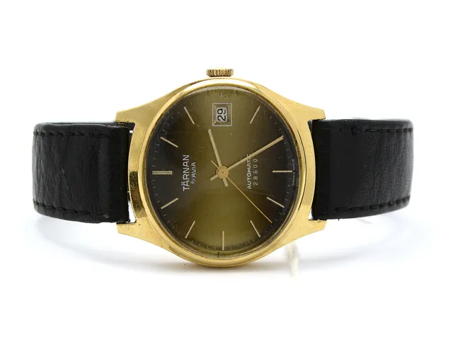 Herrur Tärnan automatic 18K med läderarmband. Repigt plastglas.