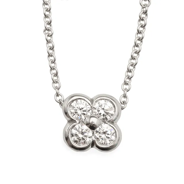 TIFFANY & CO. “ Flower” vedhæng i halskæde med fire brillantslebne diamanter af platin. 0,28 ct.