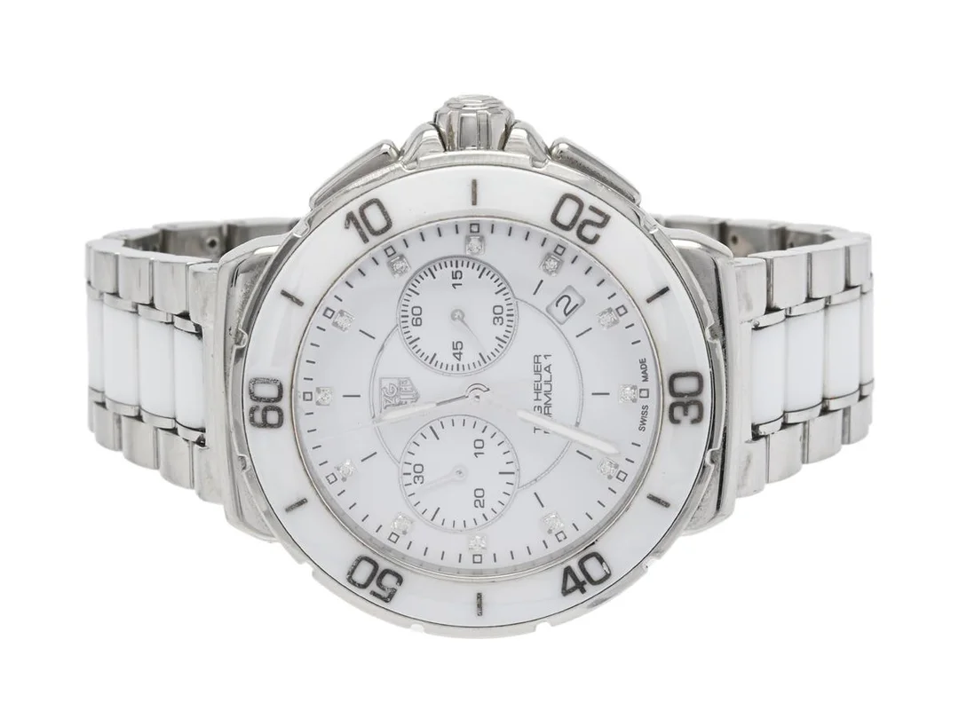 TAG HEUER, Formula 1, Serie nr. EKP5419, Ref nr. CAH1211.BA0863, Boett nr. CAH1211, kronograf (defekt), unisex, 41 mm, stål/ceramic, quartz, safirglas (nagg), datum, diamanturtavla (12 st. ca 0,088 ctv), skadad urtavla/visare, defekt (servicebehov), originallänk (stål/ceramic), viklås, Ref nr. BA0863-G-P8, ca 2013. — Klockor/Tag Heuer — Kaplans