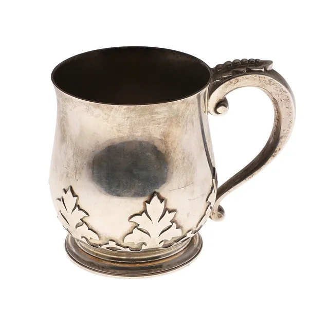A GEORGE V SILVER MUG.