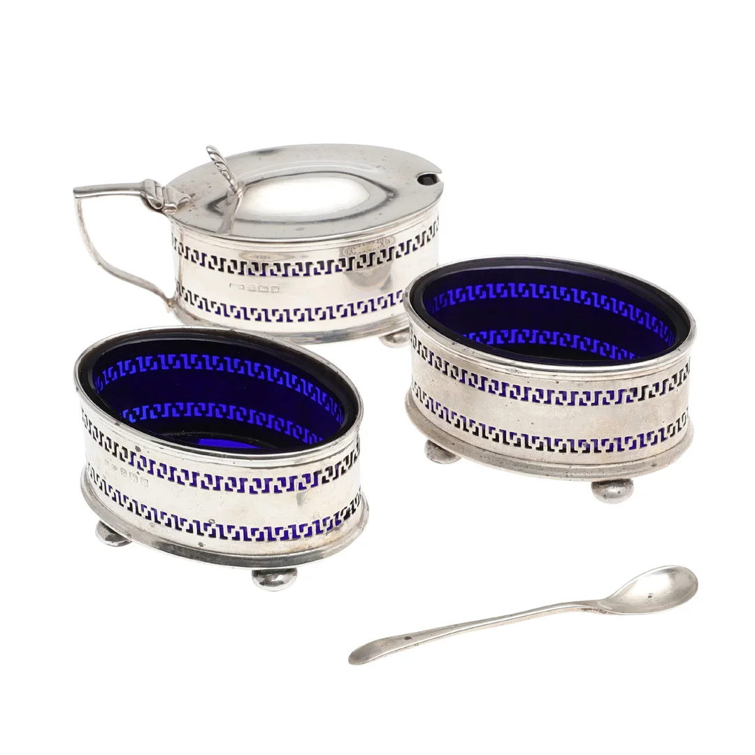 A GEORGE V THREE PIECE SILVER CONDIMENT SET. — Silver — Lawrences Auctioneers