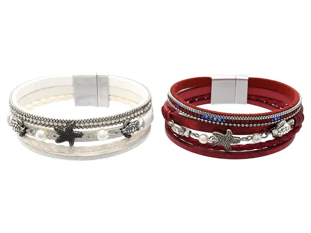 2 ARMBAND, läder, vitmetall, strass, imitationspärlor, magnetlås, längd ca 18 cm.