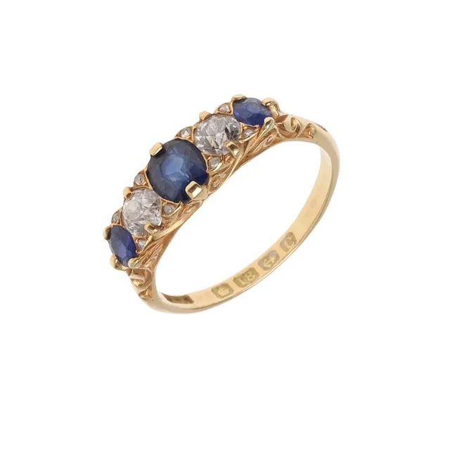 A SAPPHIRE AND DIAMOND FIVE STONE RING.