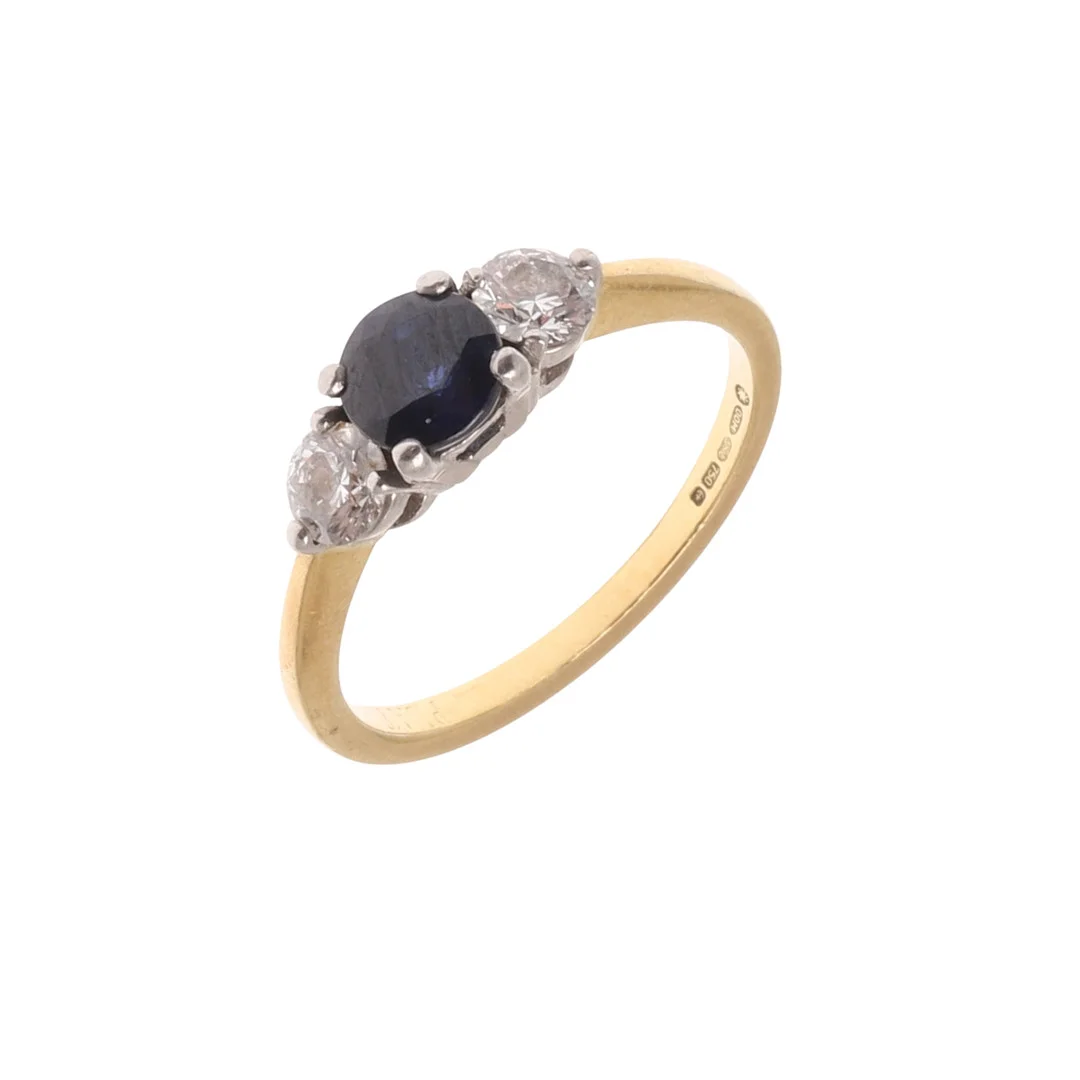 A SAPPHIRE AND DIAMOND THREE STONE RING. — Rings — Lawrences Auctioneers