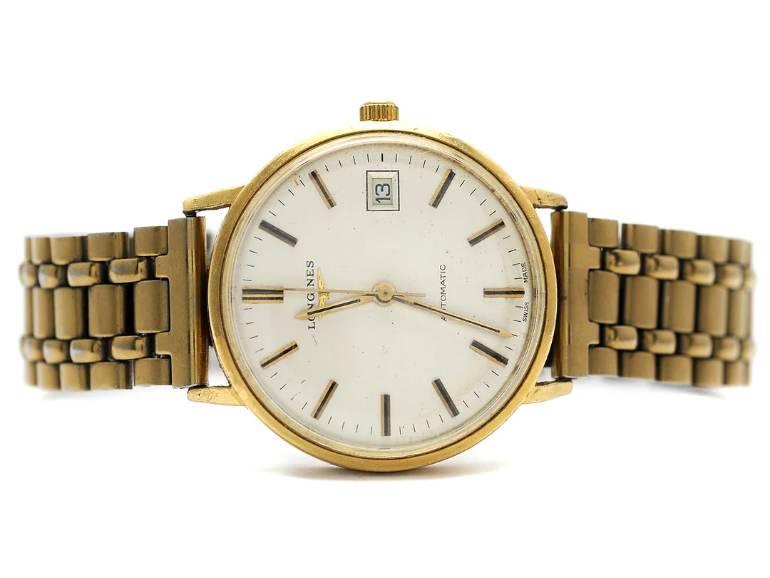 LONGINES, herrur, 35 mm, Cal L.633.1, Serie nr. 52990883, Ref nr. 1603, Boett nr. 18077737, 18K guld, automatisk, plexiglas, datum, skadad urtavla, defekt, skadad boett, ca 1977, metallänk ej original. — Klockor/Longines — Kaplans