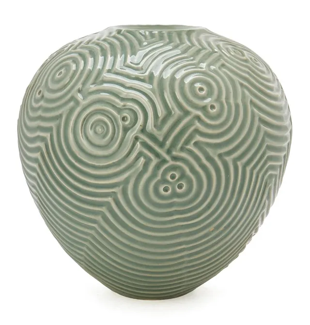 A stoneware vase modelled with incised relief decor. Decorated with celadon glaze. Signed Weiss 2011. Unique. H. 26 cm. Diam. c. 25 cm.