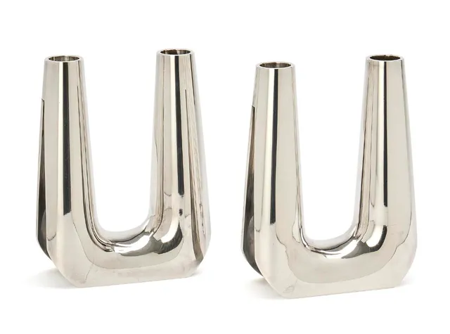 A pair of sterling silver candelabra with smooth, slightly tapered arms. Georg Jensen 1945–1977. Design no. 1037. Designed 1963. Weight 1740 gr. H. 18 cm. (2)