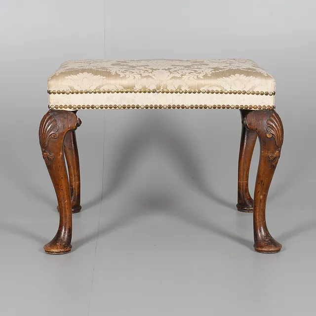 A WALNUT STOOL, CIRCA 1740 AND LATER.