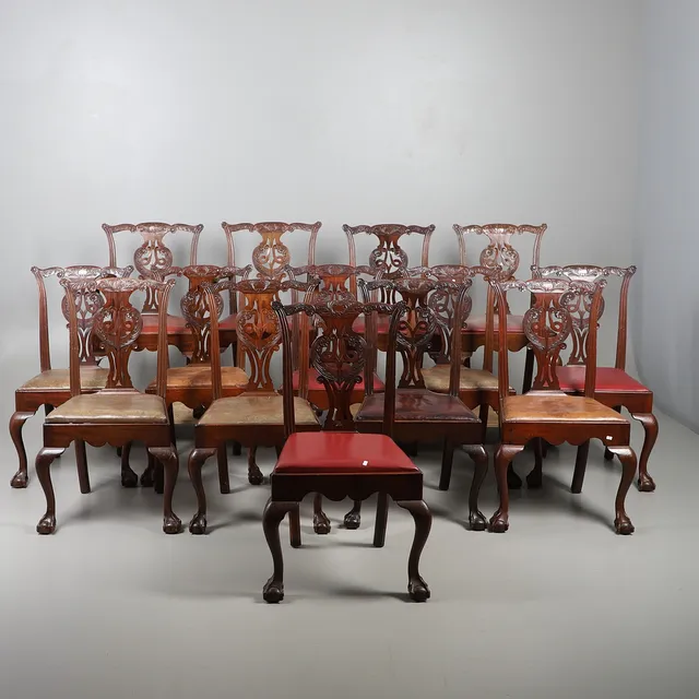 A SET OF FOURTEEN IRISH MAHOGANY DINING CHAIRS IN THE CHIPPENDALE STYLE.
