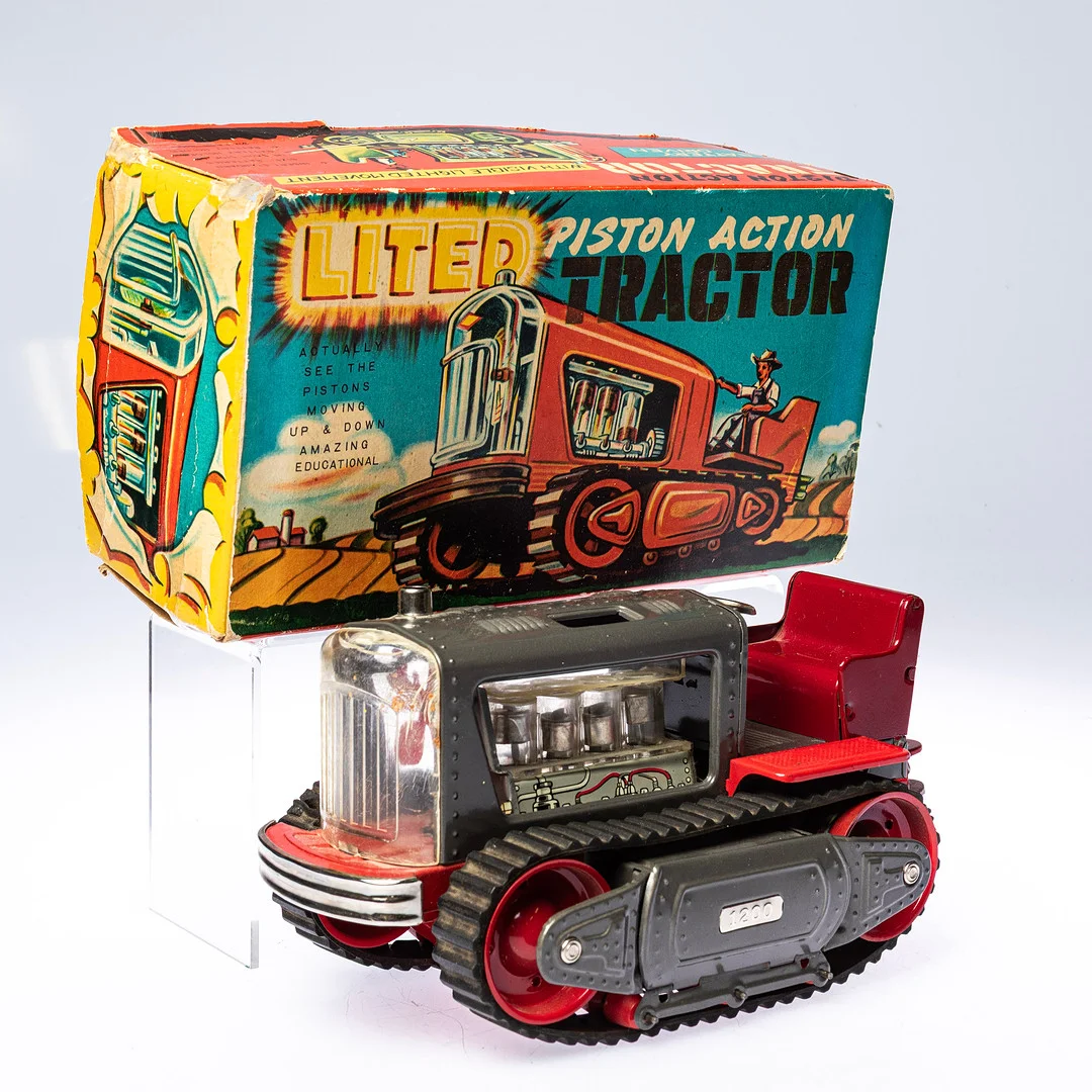 NOMURA TOYS, Plåtleksak, "Lited Piston Action Tractor", lackerad plåt,, originalkartong, Japan, 1950/60-tal. — Model cars — Handelslagret Auktionsservice
