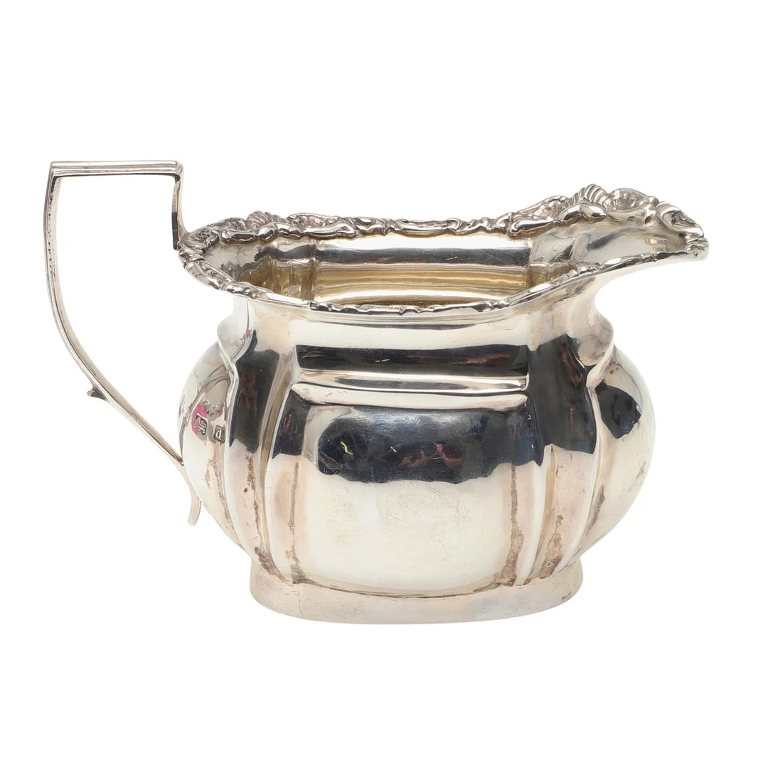 AN EDWARDIAN SILVER MILK JUG. — Silver — Lawrences Auctioneers