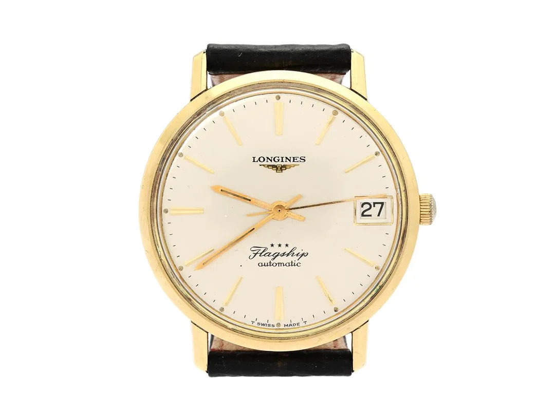 LONGINES, Flagship (T Swiss Made T), Cal 345, Serie nr. 13498821, Boett nr. 3318-4 / 433, herrur, 35 mm, guld på stål, automatisk, plexiglas, datum, skadad urtavla/visare, defekt (akut servicebehov), läderband, originalspänne i doublé (ej tidsenlig), ca 1966, box (ej komplett).. — Klockor/Longines — Kaplans