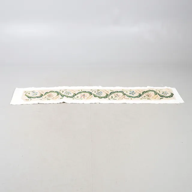 A LENGTH OF 18TH CENTURY EMBROIDERY.