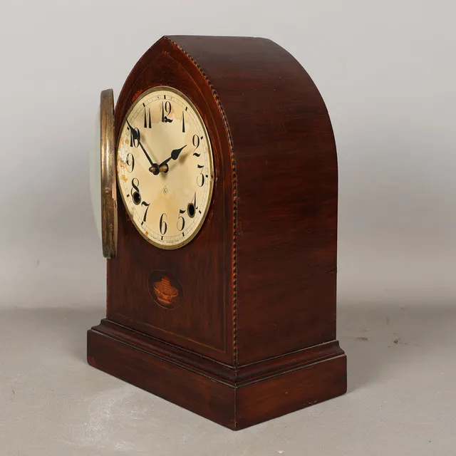 AN EDWARDIAN MAHOGANY INLAID MANTEL CLOCK BY L. GILBERT CLOCK CO.