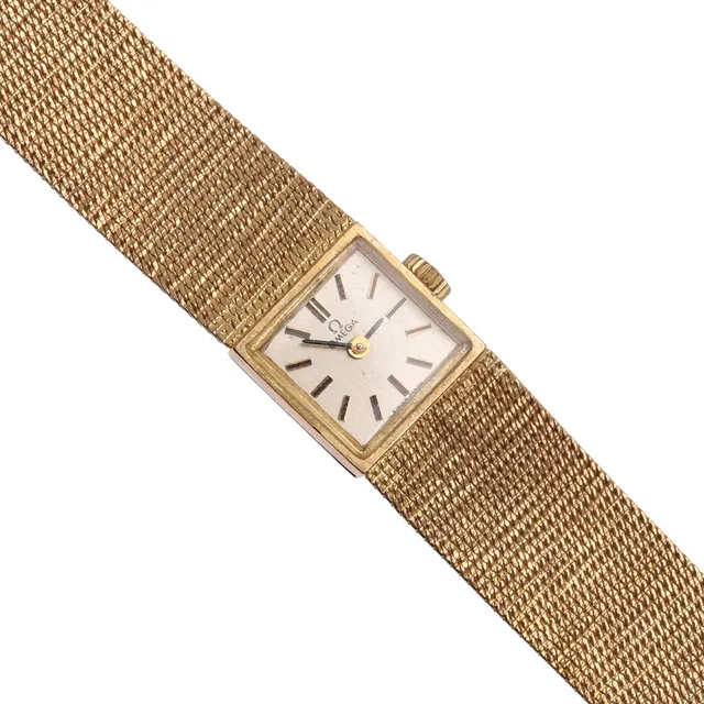 A LADY'S 9CT GOLD WRISTWATCH BY OMEGA.