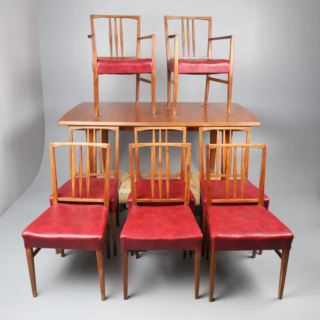 MID-CENTURY GORDON RUSSELL WALNUT AND TEAK DINING TABLE AND 8 CHAIRS. (9).