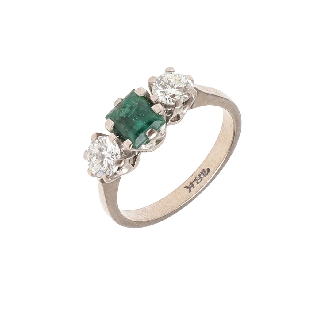 AN EMERALD AND DIAMOND THREE STONE RING. — Rings — Lawrences Auctioneers