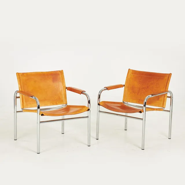 TORD BJÖRKLUND. Fåtöljer, 1 par, "Klinte", Ikea, stomme i stålrör, rygg, sits och armlän klädda med läder.