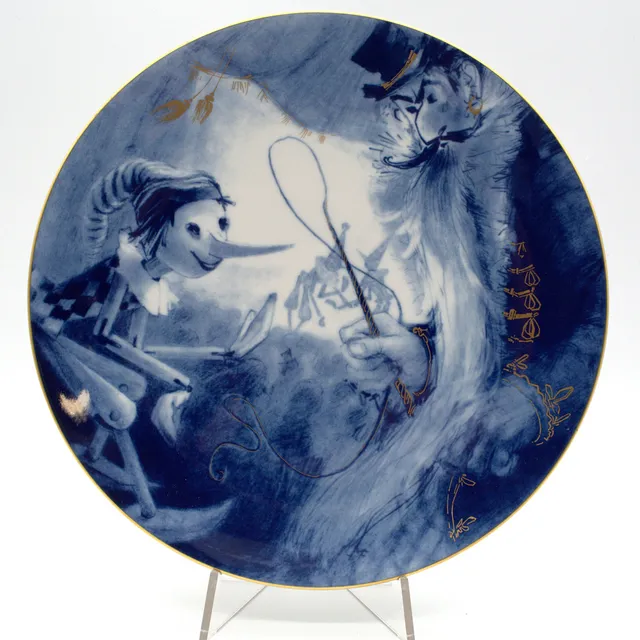 MEISSEN. WANDTELLER, „PINOCCHIOS ABENTEUER“, 20. JAHRHUNDERT, 1. WAHL, D. 25,5 CM.