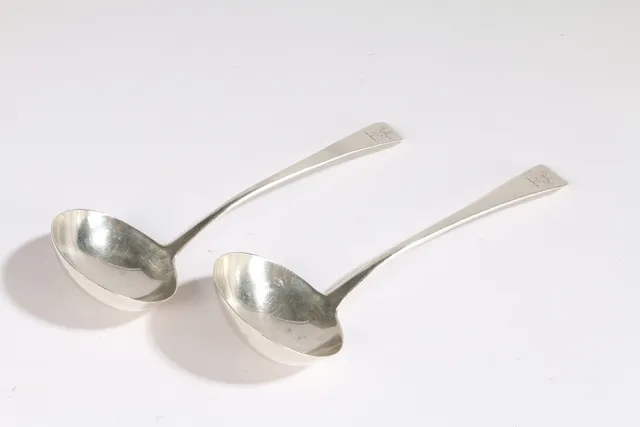 A PAIR OF GEORGE III SILVER LADLES.
