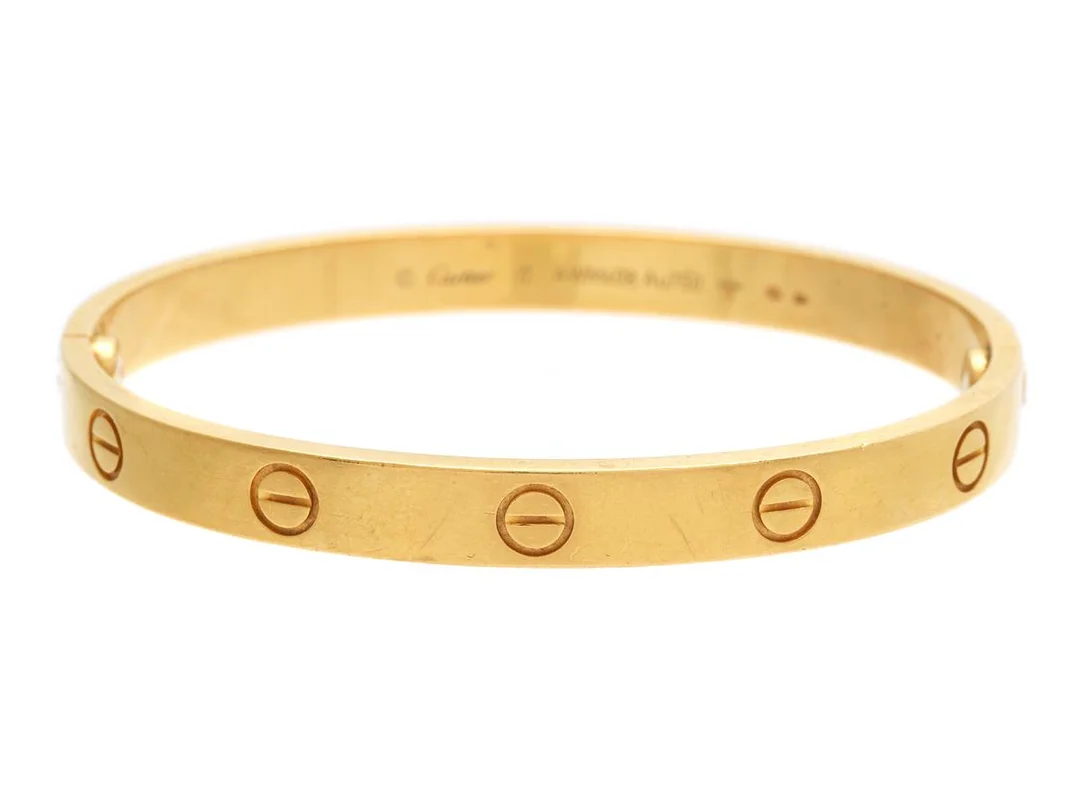 CARTIER, armband, 18K guld, Love bracelet, stl 17, vikt 32,1 g, ref nr AWM408, etui, resekit, skruvmejsel, slitage. — Smycken/Armband — Kaplans