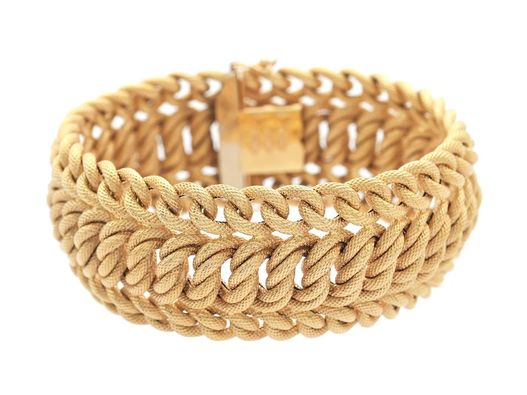 ARMBAND, 18K guld, Italien, 1900-talets andra hälft, bredd 27 mm, längd 19 cm, vikt 45,9 g. — Smycken/Armband — Kaplans