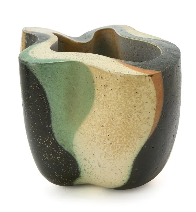 Sculptural stoneware vase. Decorated with green, brown, black and pale yellow glaze. Signed monogram, 83. Unique. H. 18.5 cm. Diam. 20–23 cm.