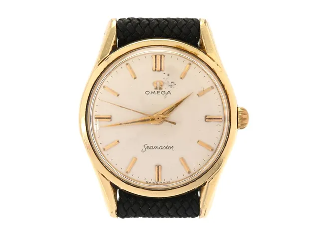OMEGA, Seamaster, Cal 284, Serie nr. 16948520, Ref nr. KO 2938, Boett nr. 2938-2 SC (HF), herrur, 36 mm, guld på stål, manuell, plexiglas, skadad urtavla, perlonband, ca 1958.