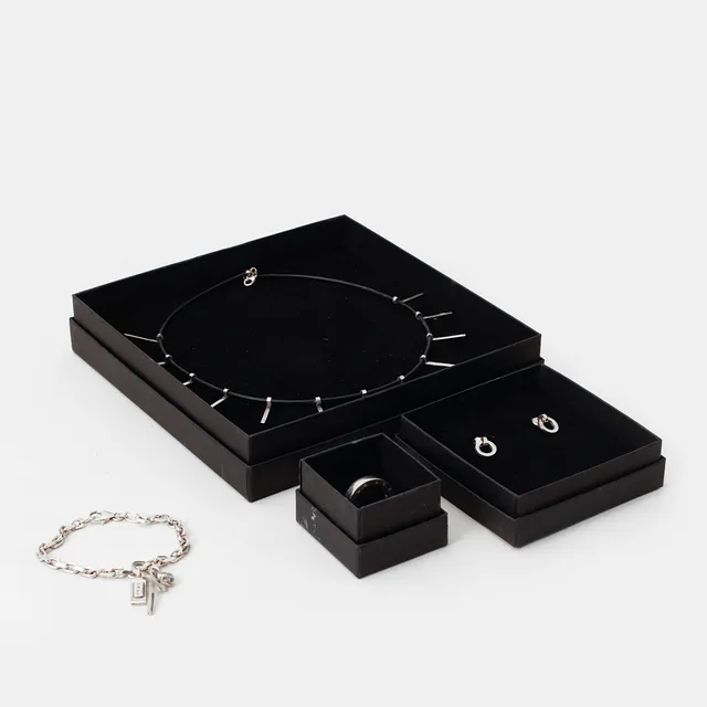 EFVA ATTLING. Collier, armlänk, ring och örhängen, ett par, silver.