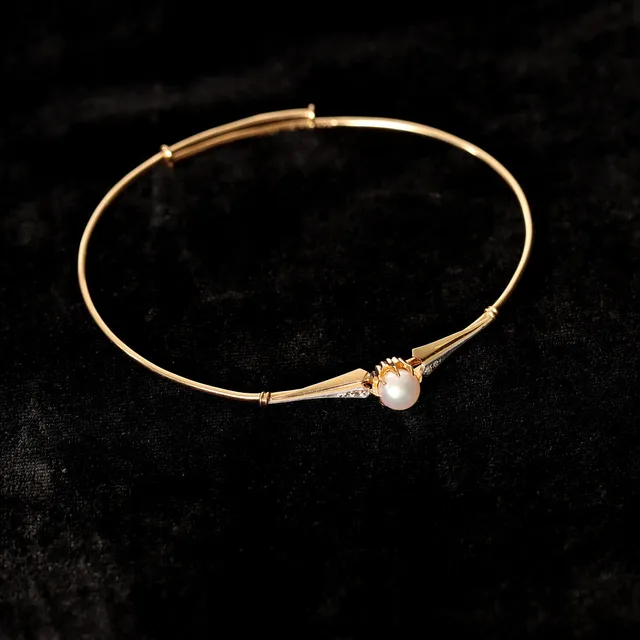 ARMBAND MED PÄRLA, 18K guld, 1926.
