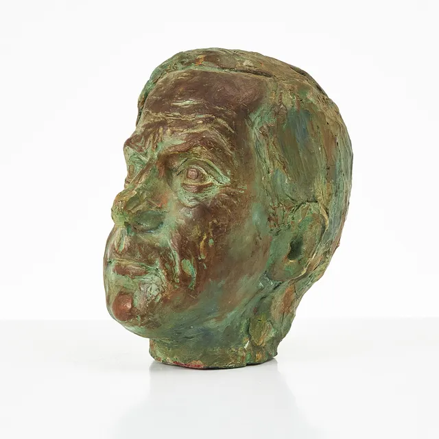 ELVINE OSTERMAN (1908-1997). Manshuvud, lergods, bemålat.
