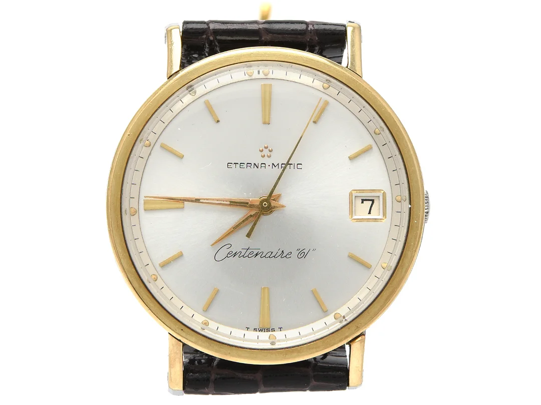 ETERNA-MATIC, Centenaire "61", Cal 1438 U, Serie nr. 5020468, Boett nr. 4832388 / 306 IVT, herrur, 34,5 mm, guld på stål, automatisk, plexiglas, datum, läderband, ca 1962. — Klockor/Eterna — Kaplans