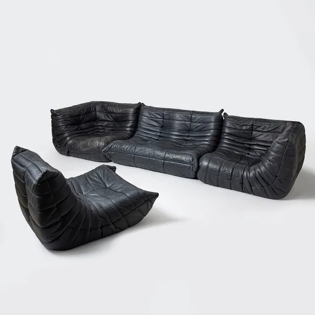 MICHEL DUCAROY. “Togo”, four-piece sofa set, Ligne Roset, France, model designed 1973, black calfskin upholstery.