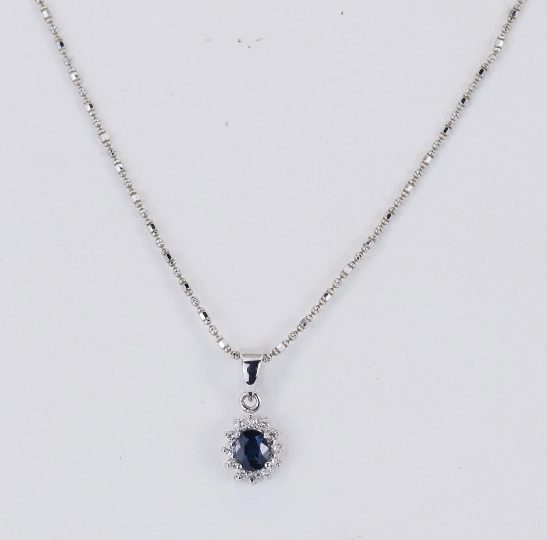 18CT SAPPHIRE AND DIAMOND PENDANT. — Brooches & Pendants — Chalkwell Auctions