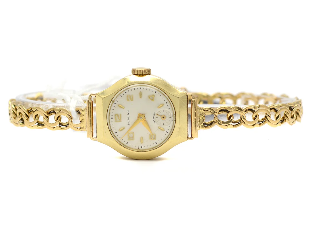 Armbandsur Svalan, manuell, brv 16,9g, Ø21mm, 14K i boett (ca 3,0g), armlänk Bismarck 18K 19cm (ca 8,0g), bruksslitage slitage, repa i glas, små nagg — Klockor/Svalan — Kaplans