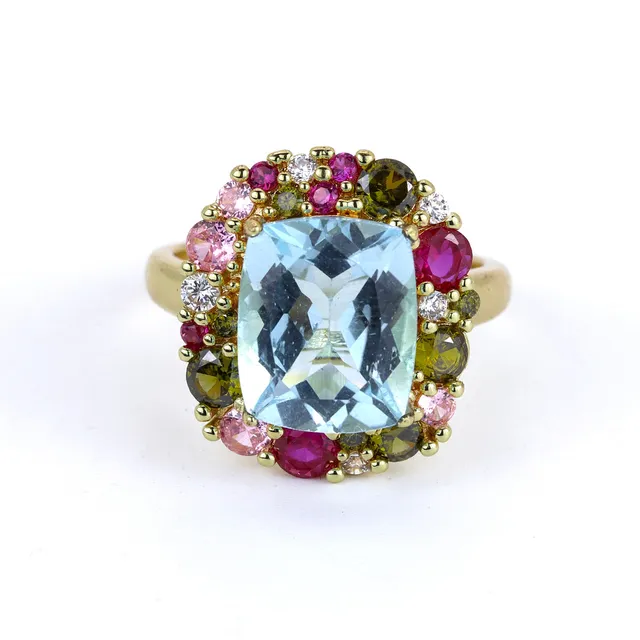 SILVER GILT BLUE TOPAZ SET RING.