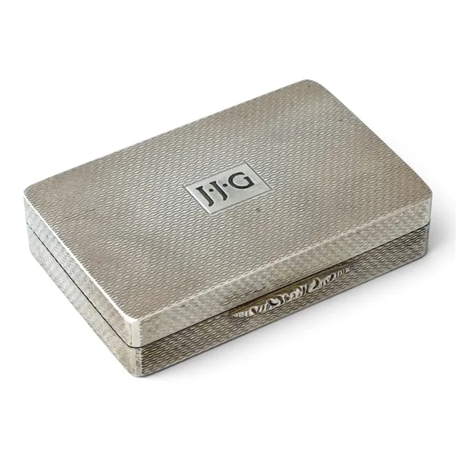 AN ELIZABETH II SILVER PILL BOX MONOGRAMMED JJG.