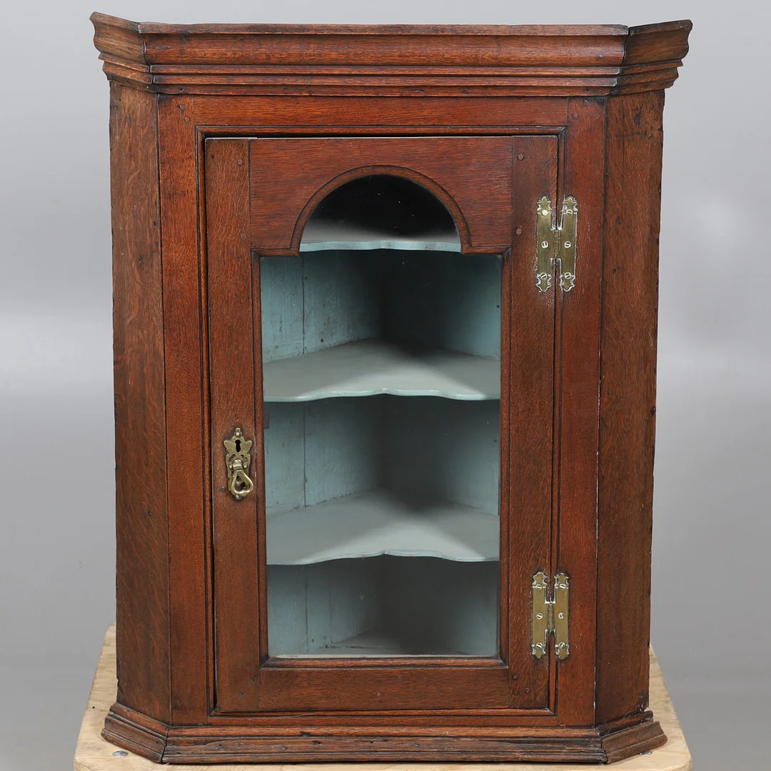 A 19TH CENTURY GLAZED OAK HANGING CORNER CUPBOARD. — Cupboards, Cabinets & Shelves — Lawrences Auctioneers