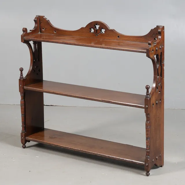 A 19TH CENTURY MAHOAGNY SET OF HANGING SHELVES.