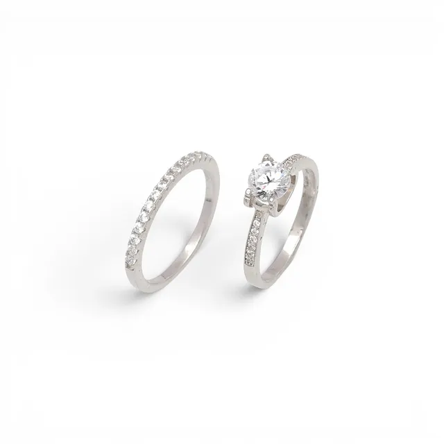 Solitaire ring and half-band ring with zircons.