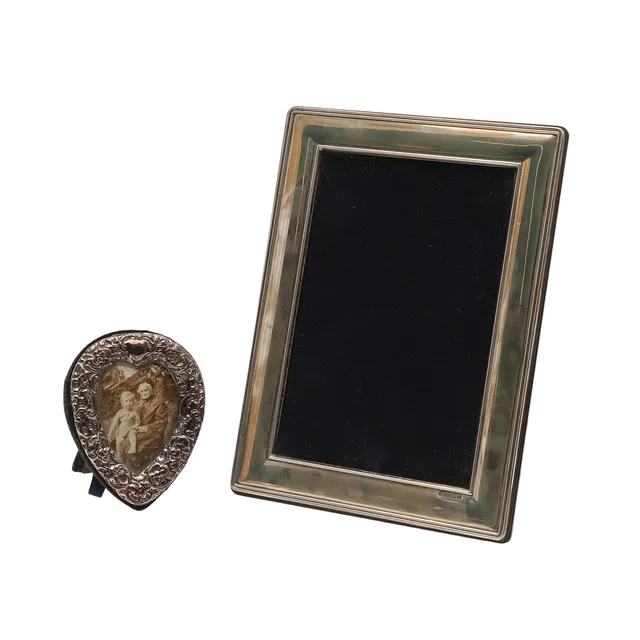 AN ELIZABETH II SILVER FRONTED PHOTOFRAME AND ANOTHER SMALLER.