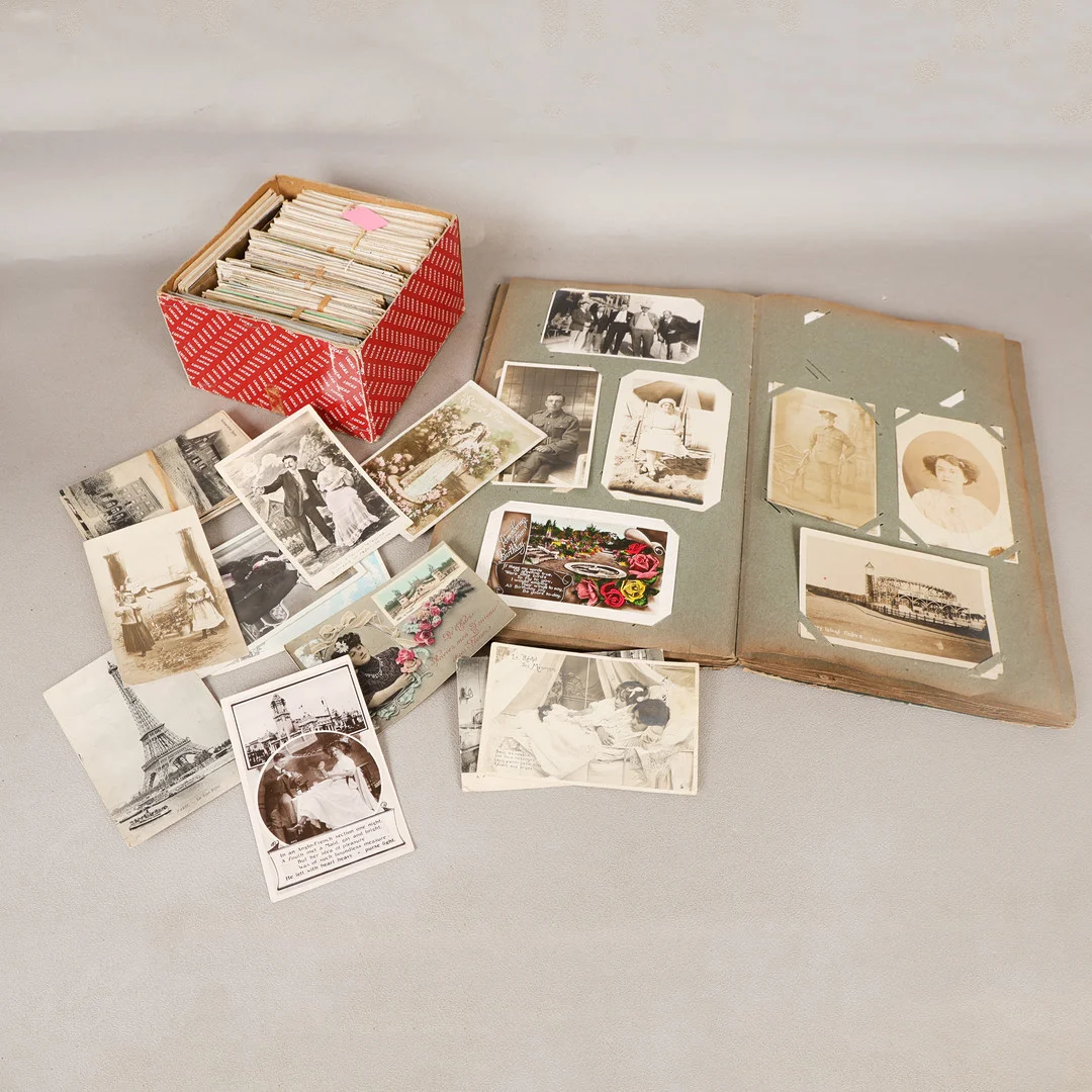 AN EARLY 20TH CENTURY POSTCARD ALBUM AND LOOSE POSTCARDS (QTY). — Other collectables — Bishop & Miller