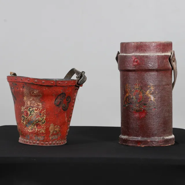 A 19TH CENTURY LEATHER FIRE BUCKET AND A LEATHER SHOT CARRIER.